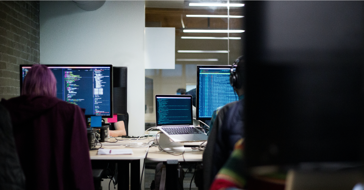People in an office working on computers.