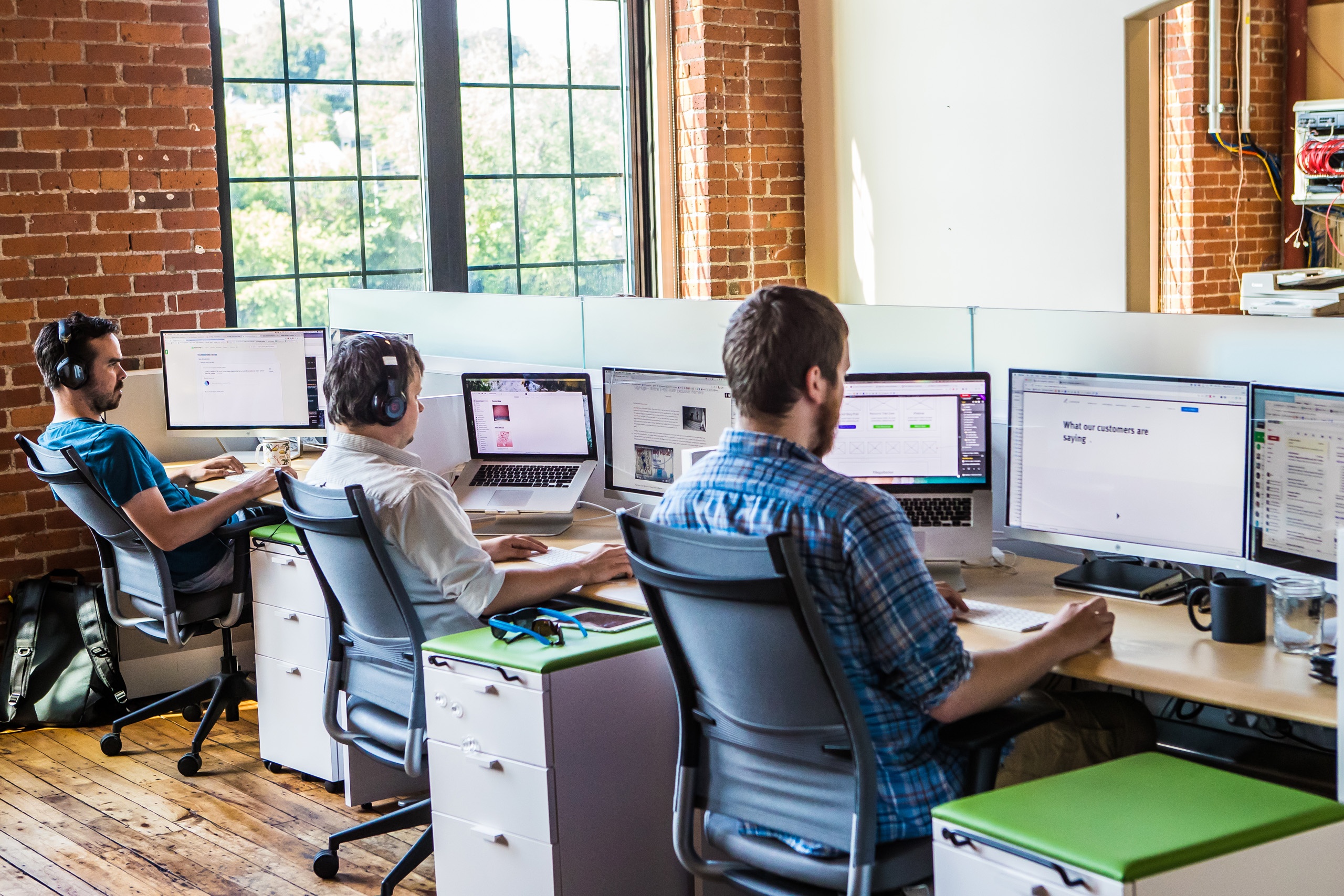 three_new_breeders_working_at_desks